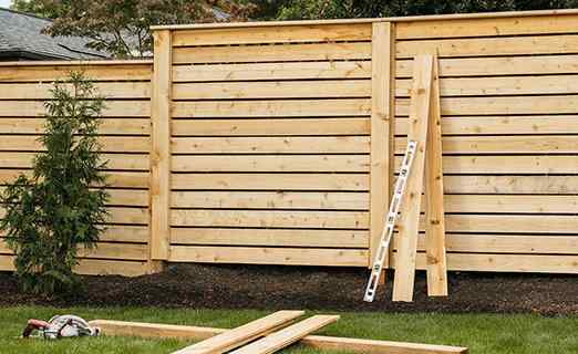 Cedar horizontal plank privacy fence — Belton, MO installation FAQ — RKC Wood Care Pros