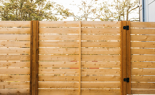 Cedar board-on-board privacy fence with kickboard in Mission, KS — RKC Wood Care Pros