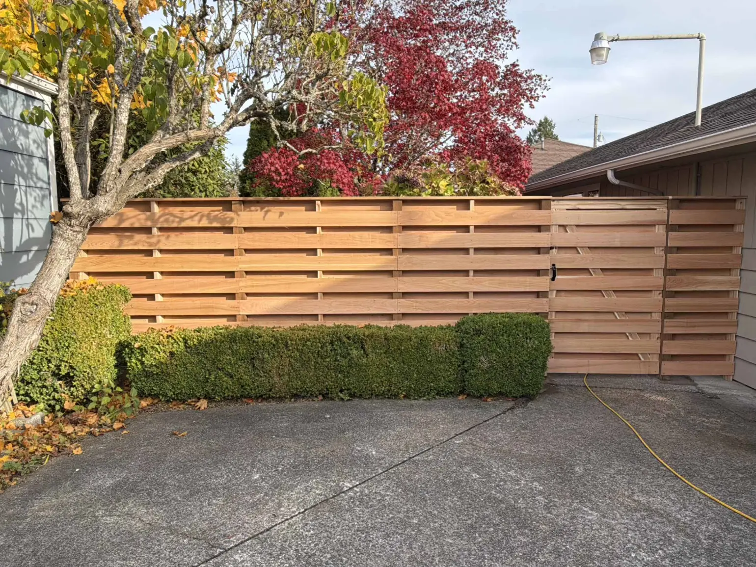 Cedar shadow box cap rail HOA fence pricing — Belton, MO — RKC Wood Care Pros