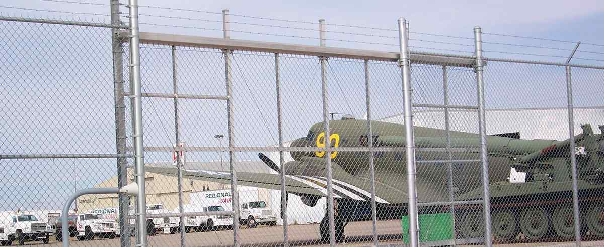 Galvanized chain link perimeter fence with knuckle-twist selvage in Lee's Summit, MO — RKC Wood Care Pros