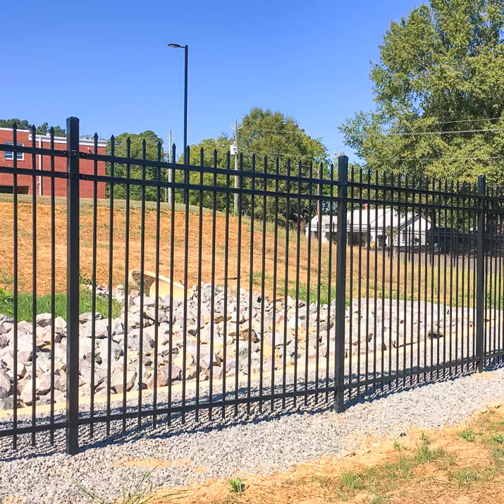 Welded steel commercial security fence with crash-rated posts in Belton, MO — RKC Wood Care Pros