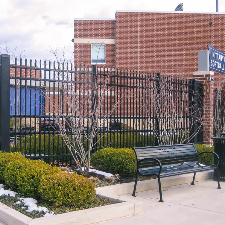 Welded steel commercial security fence with crash-rated posts in Oak Grove, MO — RKC Wood Care Pros