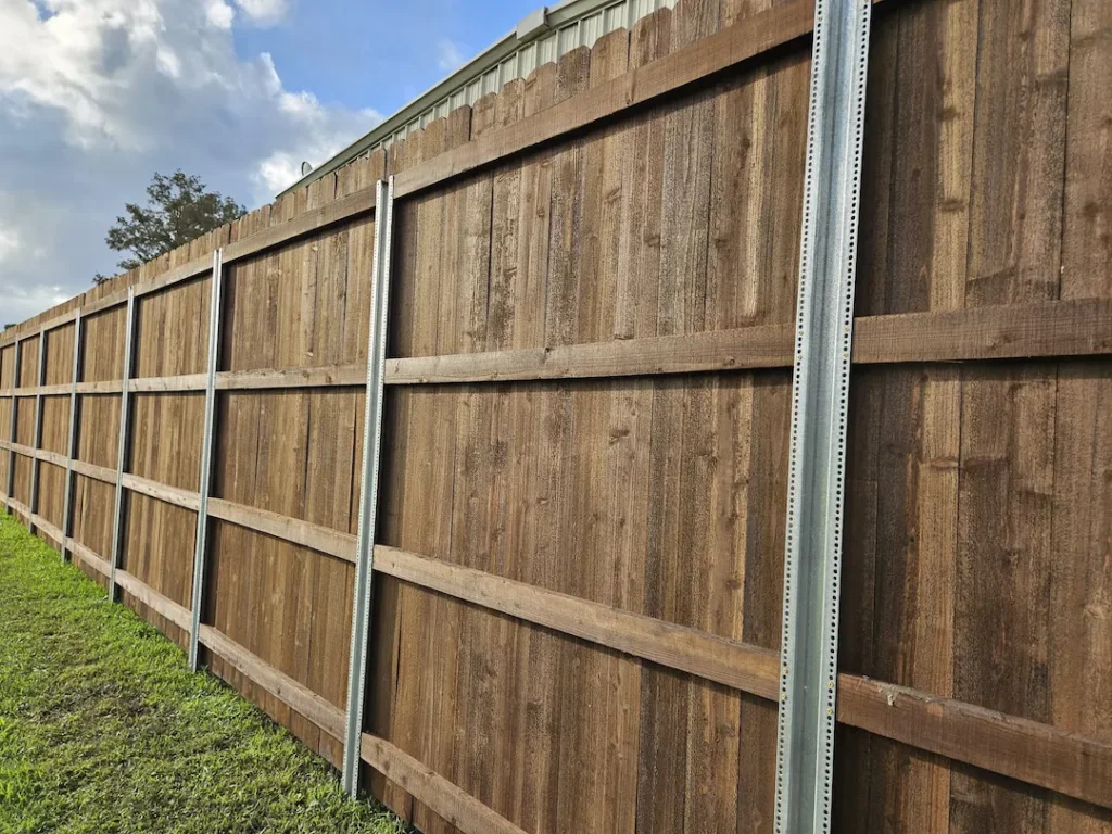 Cedar dog-ear picket privacy fence with galvanized ring-shank fastening in Lee's Summit, MO — RKC Wood Care Pros