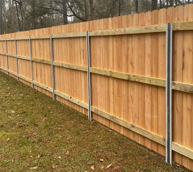 Cedar board-on-board privacy fence with kickboard in Smithville, MO — RKC Wood Care Pros