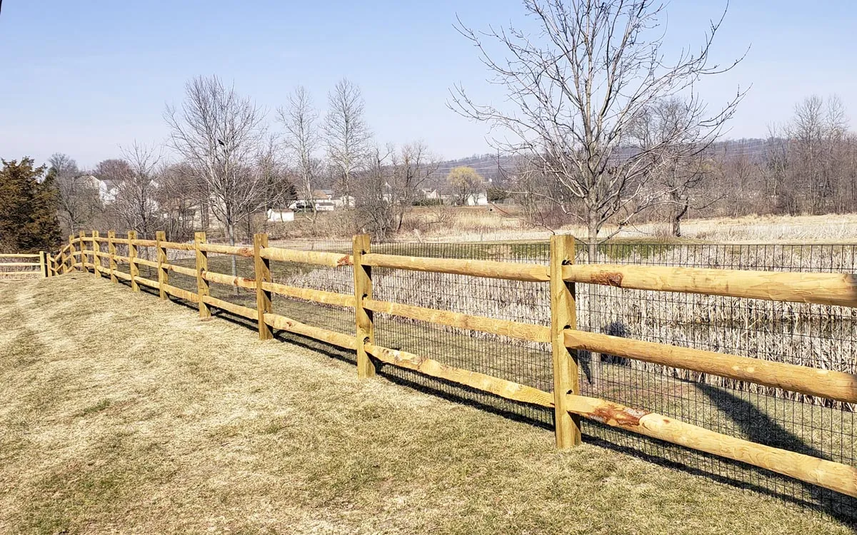 Cedar dog-ear picket privacy fence with galvanized ring-shank fastening in Raymore, MO — RKC Wood Care Pros