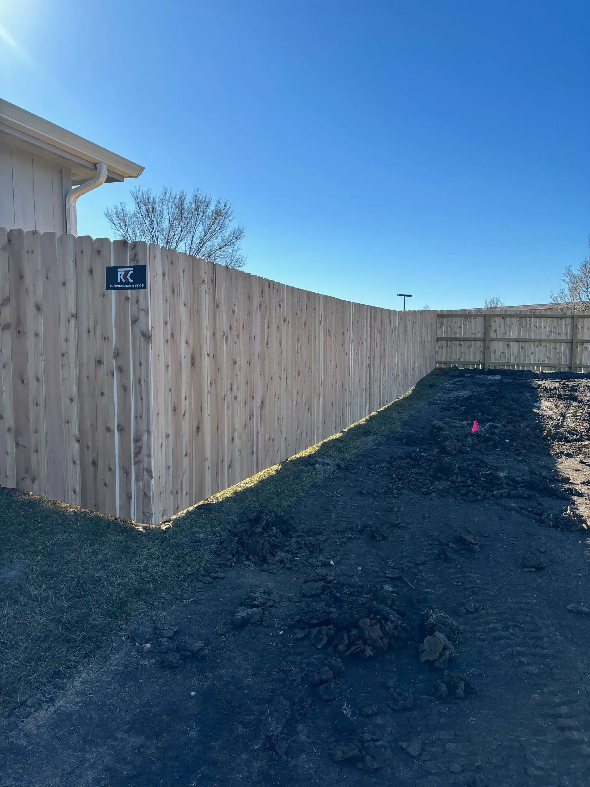 Ornamental aluminum fence with puppy panel in Prairie Village by RKC Wood Care Pros
