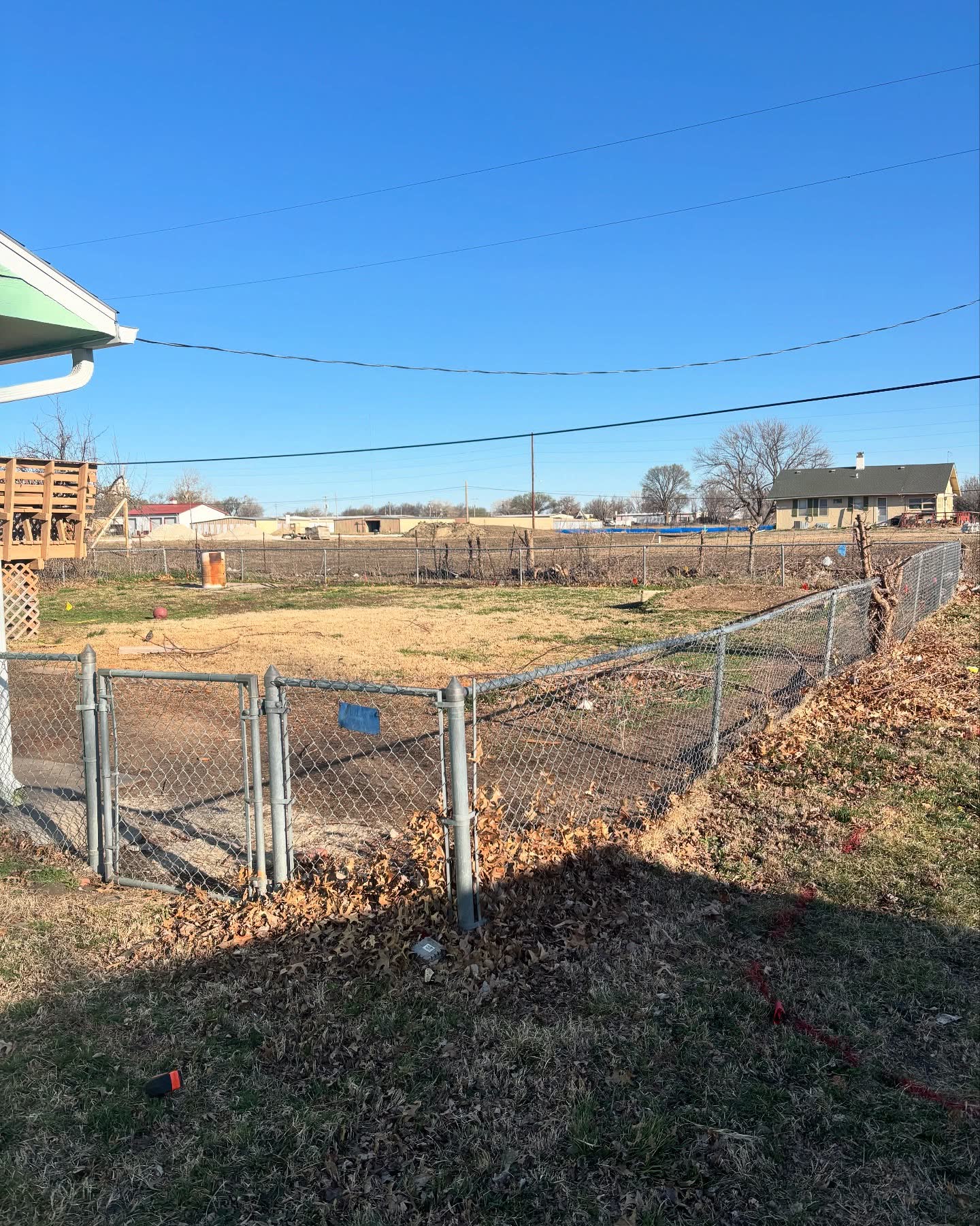 Galvanized chain link residential fence with walk gate in a Kansas City backyard — RKC Wood Care Pros