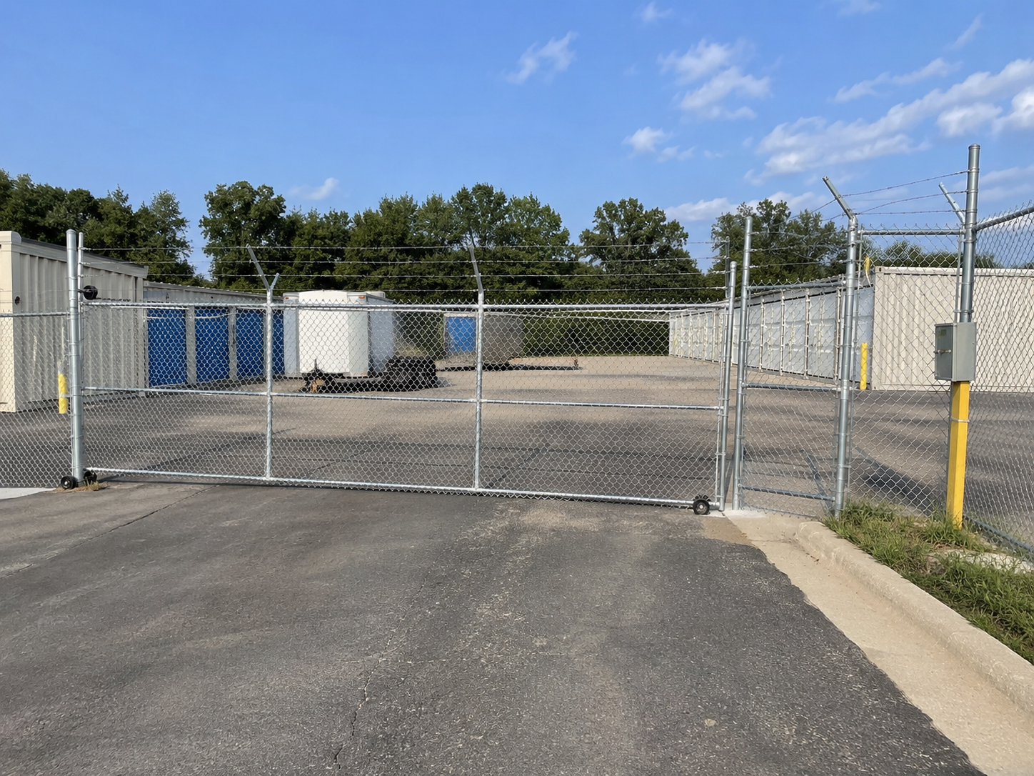 Commercial ornamental aluminum fence at apartment complex in Overland Park, KS by RKC Wood Care Pros