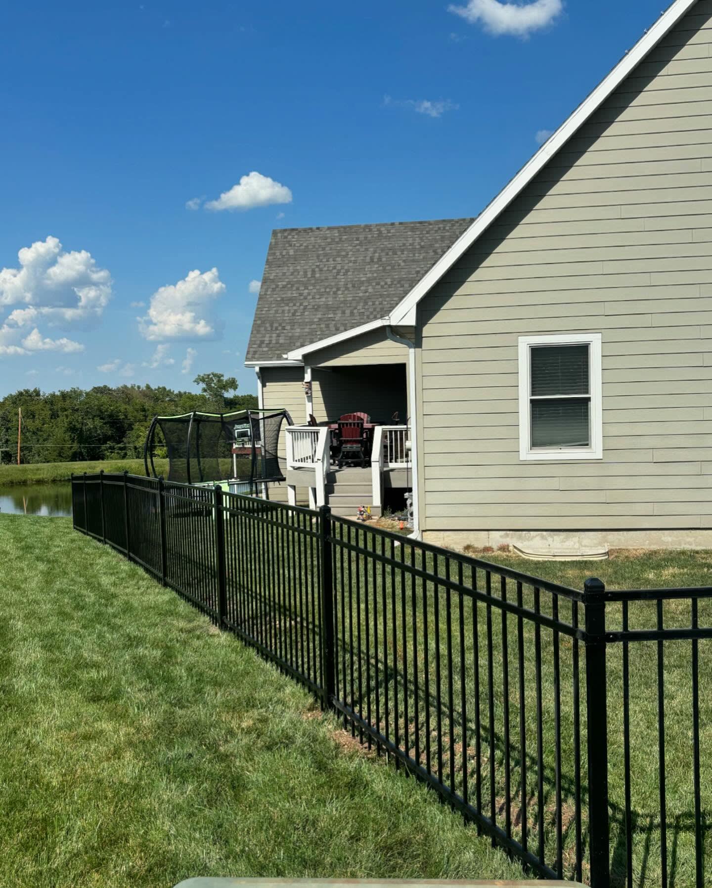 Pool-code ornamental iron fence in Overland Park, KS by RKC Wood Care Pros