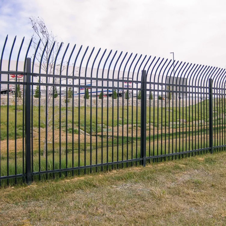 Powder-coated steel ornamental security fence with spear-top finials at a Kansas City commercial property — RKC Wood Care Pros