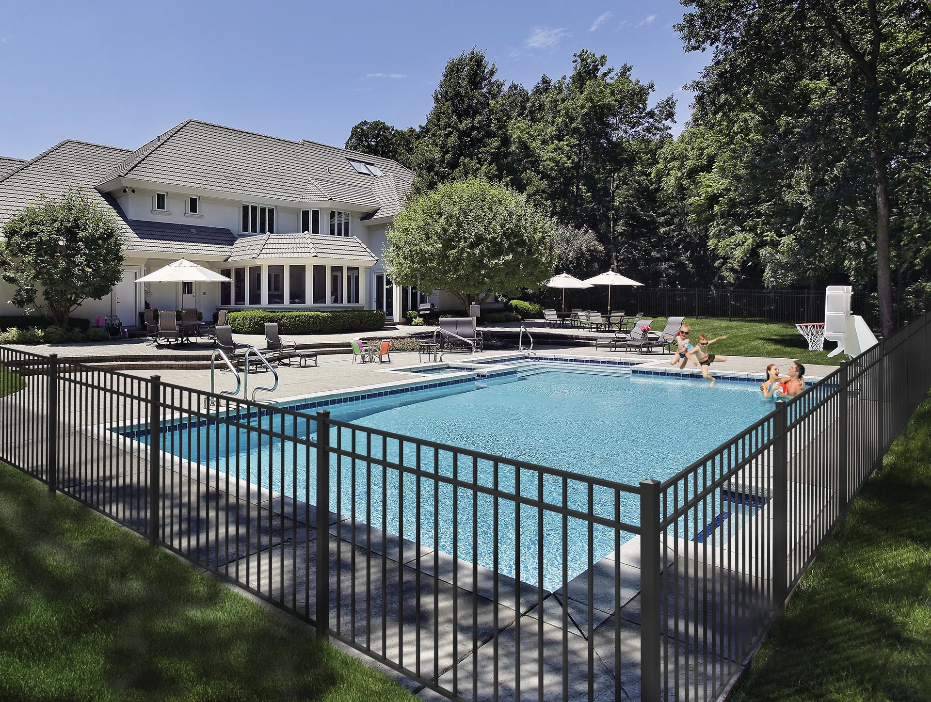 Black aluminum pool fence enclosing a residential swimming pool at a Kansas City estate — RKC Wood Care Pros