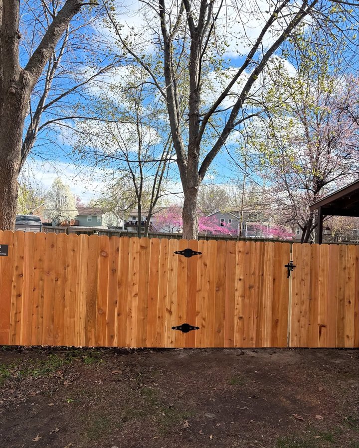 Finished cedar privacy fence install in a Peculiar, Missouri backyard by RKC Wood Care Pros