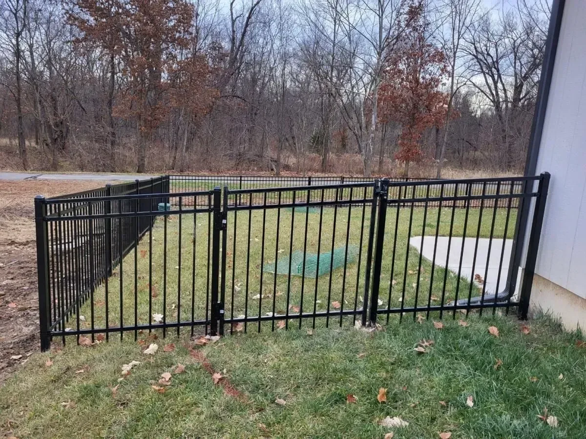 Side view of black aluminum ornamental fence along property line in Prairie Village, KS