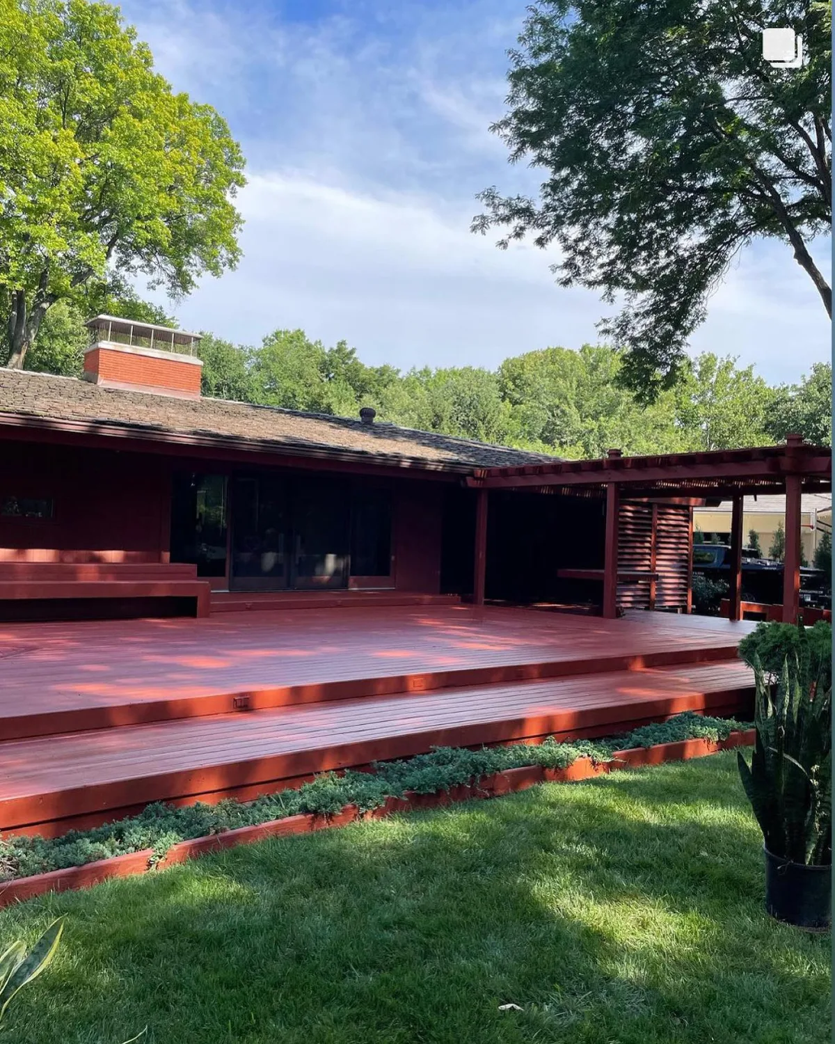 Pergola corner detail with outdoor furniture on freshly stained deck in Liberty, MO
