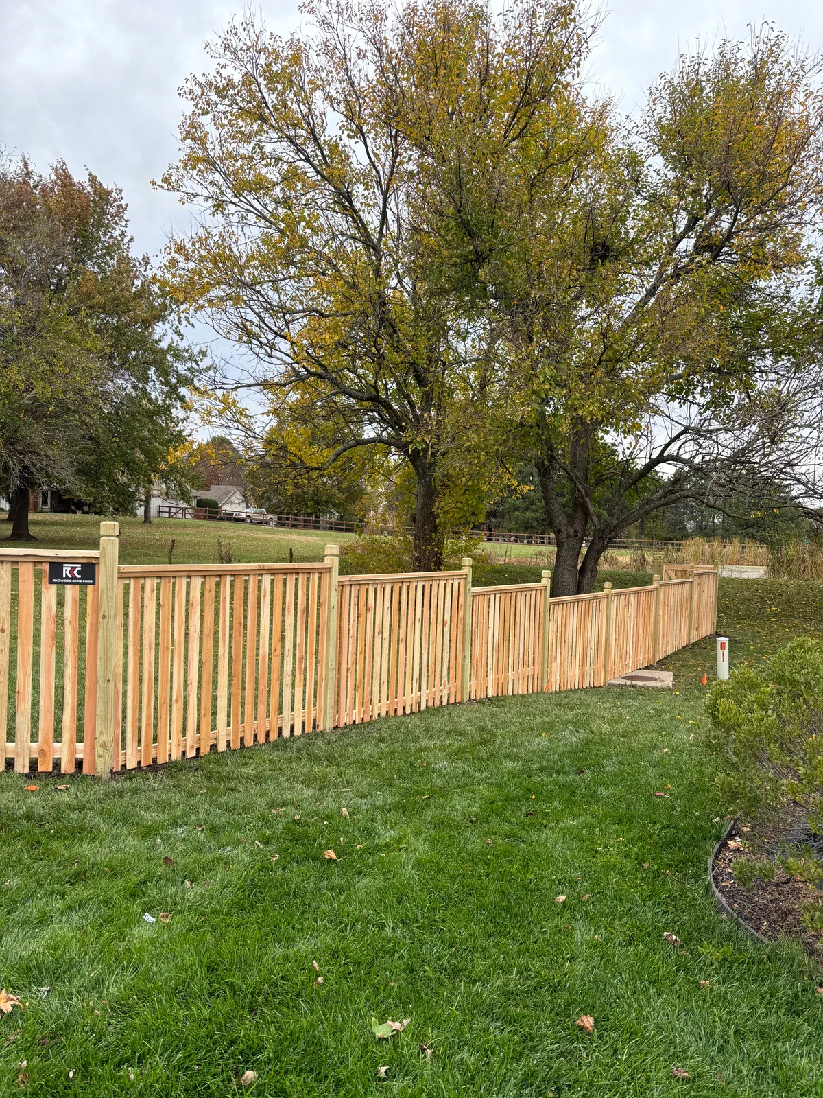 End view of horizontal cedar fence with pressure-treated posts in Gardner, KS